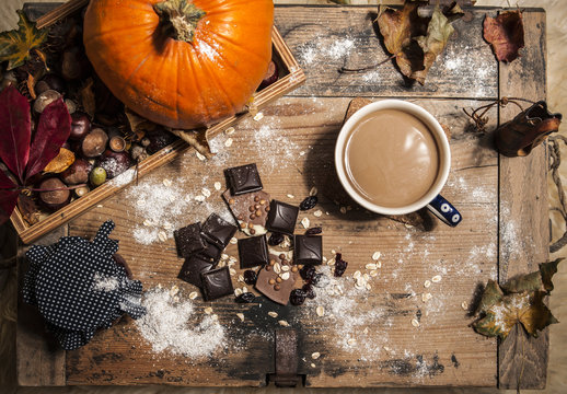 Chocolate and coffe or hot cocoa in autumn still life scenery concept