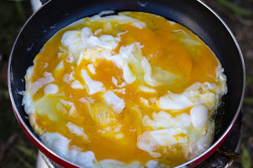 Fried omelet on the pan.