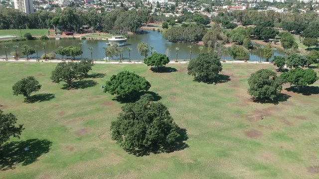 Flying over shot made with drone of trees in a park
