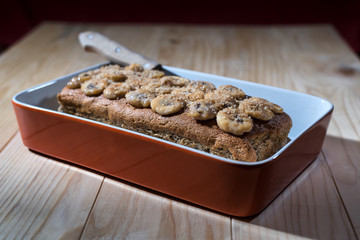 Banana bread in the baking pan ready to be sliced and served