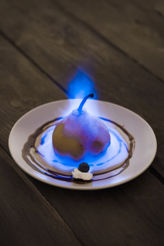 Flaming pear dessert