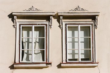 Two white windows with ornaments