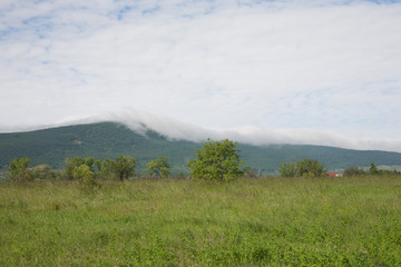 Fototapeta na wymiar Clouds on the hill in Hungary