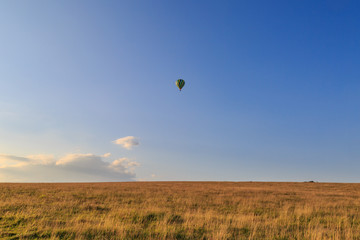 A Hot Air Balloon over the South Downs in Sussex, on a late summer evening.