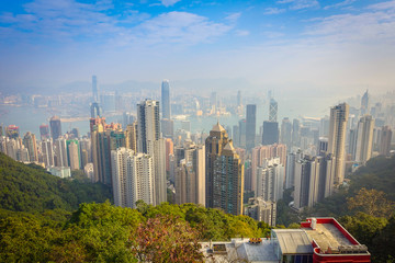 Beautiful view from Victoria Peak to the city of Hong Kong in the horizont in a sunny day with blue sky