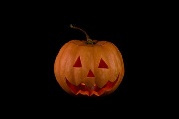 pumpkin lamp on black background