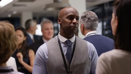  Diverse business group talking and networking at a business conference - Powered by Adobe