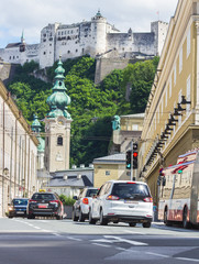 Cars in a row waiting at traffic light on street of Salzburg, Austria