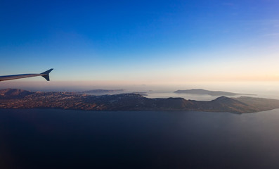 Fototapeta na wymiar Aerial view of Santorini island as seen from plane window