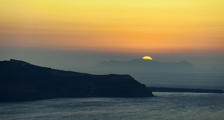 Orange sunset in oia, santorini, greece