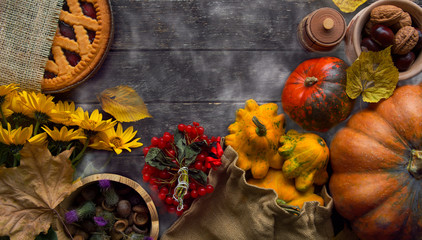 Thanksgiving day concept - traditional holiday food with pumpkins on old wooden. space for text 