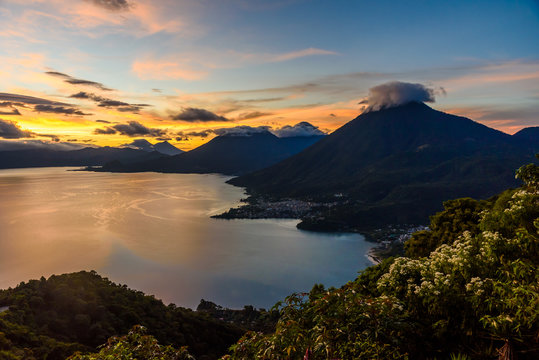 Sunrise in the morning at lake Atitlan, Guatemala - amazing panorama view to the volcanos San Pedro, Toliman and Atitlan