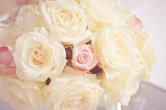 Fototapeta Close up on wedding flowers, bridal bouquet. Decoration made of roses over light celebration background