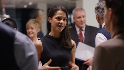  Diverse business group talking and networking at a business conference - Powered by Adobe