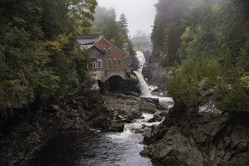 Fototapeta na wymiar Old MIll and Falls on the Magaguadavic River in St George New Brunswick Canada on a rainy day