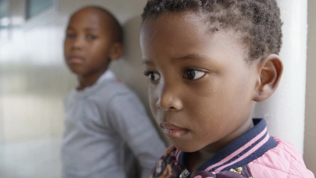 Children from South African community looking inquisitively at the camera