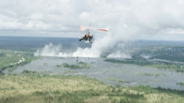 Aerial view of microlight aircraft flying above Victoria Falls and Zambezi river