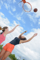Fototapeta na wymiar girls playing basketball