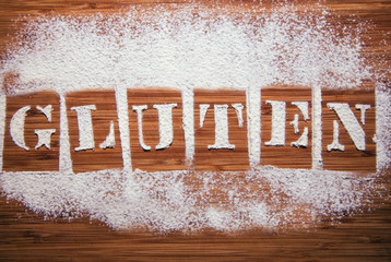 Gluten spelled out in sifted flour stencil letters