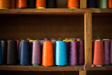 Fototapeta na wymiar Colorful Spools of Thread Blown out