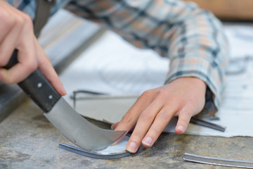 midsection of woman using putty knife