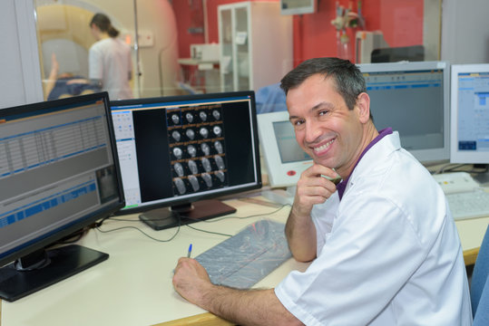 portrait of male radiologist at computers