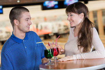 couple having a drink in a bowling club