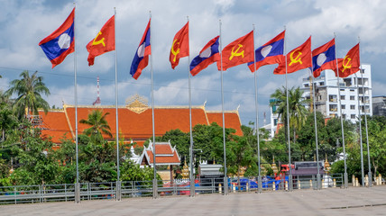 Communist and Laos flags flying in downtown Vientiane