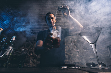 Man working at cocktail bar