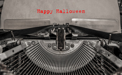 Happy Halloween printed on a vintage typewriter. old typewriter with text red happy halloween