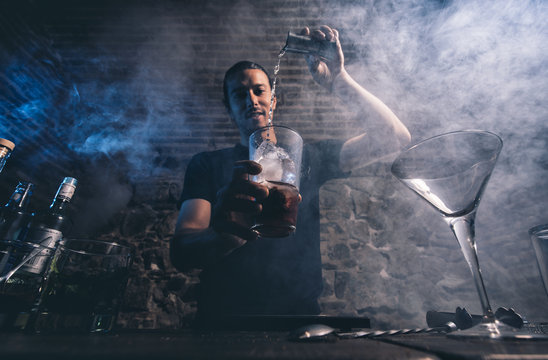 Man working at cocktail bar