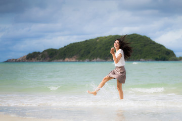Fototapeta premium Beautiful Asian woman vacation on beach of Thailand