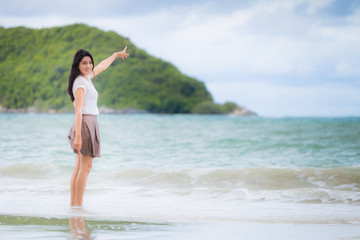 Beautiful Asian woman vacation on beach of Thailand