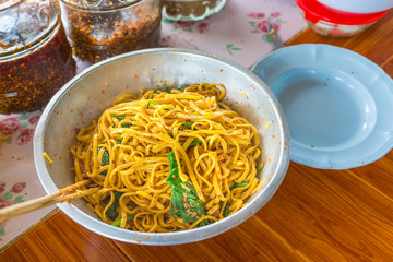 Yunnan Noodle , Kwa Meng spicy noodle soup with vegetables, herbs, peanuts and coriander, is popular noodle food of China