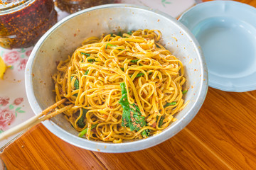 Yunnan Noodle , Kwa Meng spicy noodle soup with vegetables, herbs, peanuts and coriander, is popular noodle food of China