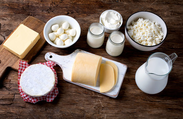 Dairy products on wooden background.