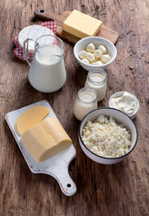 Dairy products on wooden background.