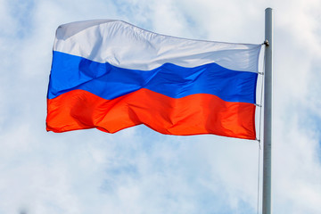 Russian flag on sky and cloud background