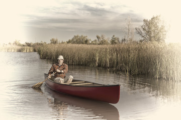 Fototapeta na wymiar afternoon canoe paddling on a lake