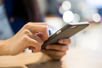 Using cellphone in coffee shop