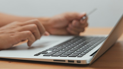 Shopping online with laptop computer and credit card