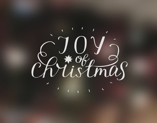 Hand lettering Joy of christmas with star.