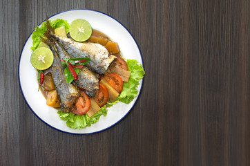 Mackerel boiled sweet and salted Thai food on old wooden table