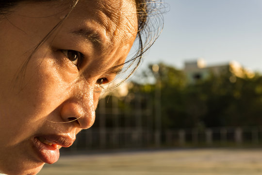 Closeup  sweating on face asian women . Exercise on park