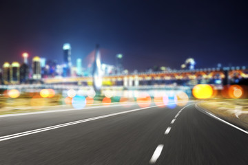 empty asphalt road with modern bridge and buildings
