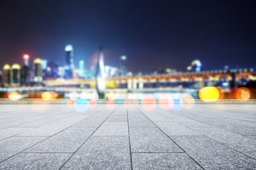 empty marble floor with modern bridge and buildings