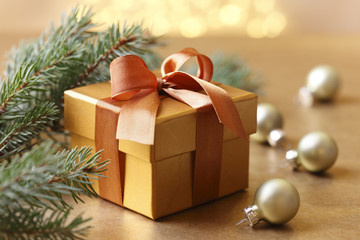 Fototapeta na wymiar Christmas gift and ornaments with pine tree branch