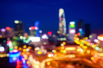 Saigon downtown and Ben Thanh Market with defocused bokeh lights as abstract background, Vietnam. Saigon is the largest city and economic center in Vietnam with population around 10 million people.