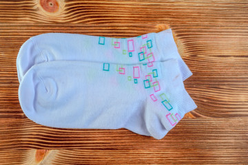 female socks on a wooden background