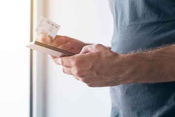 Man registering new GMS sim card on mobile phone
